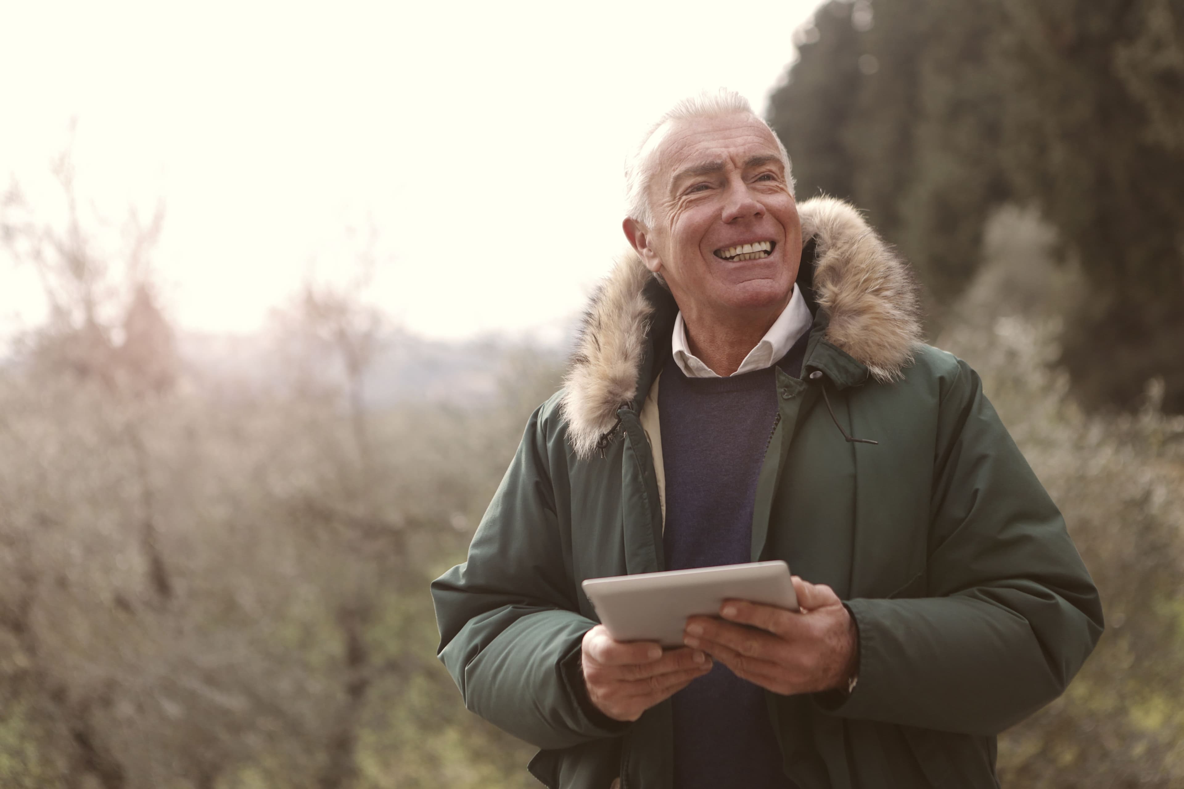 Older man smiling outdoors